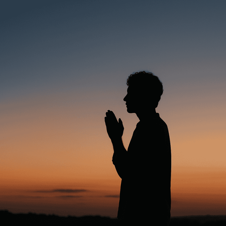 a silhouette of a person with hands clasped together while standing